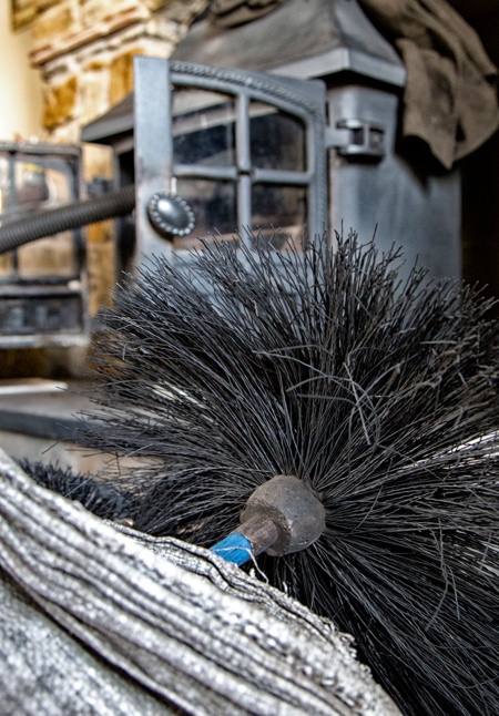 Close-up of professional chimney sweeping brushes used by Guild of Master Chimney Sweeps certified professionals